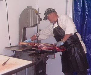 jake cutting with saw